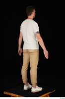  Trent brown trousers casual dressed standing white sneakers white t shirt whole body 0006.jpg